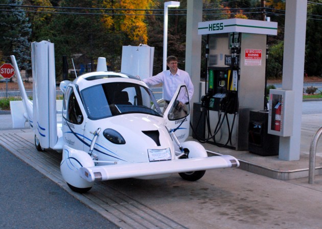 This is a picture of a guy filling up a flying car at a gas station. (Courtesy)