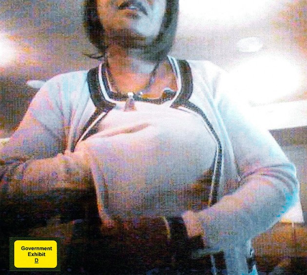 This image, taken from a undercover video, shows Wilkerson stuffing an alleged cash bribe under her sweater.