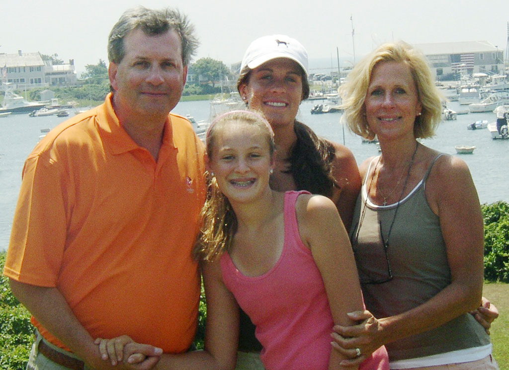 This family photo shows William Petit with his daughters Michaela, front, Hayley, rear, and his wife, Jennifer Hawke-Petit, on Cape Cod in June 2007. (Via AP)