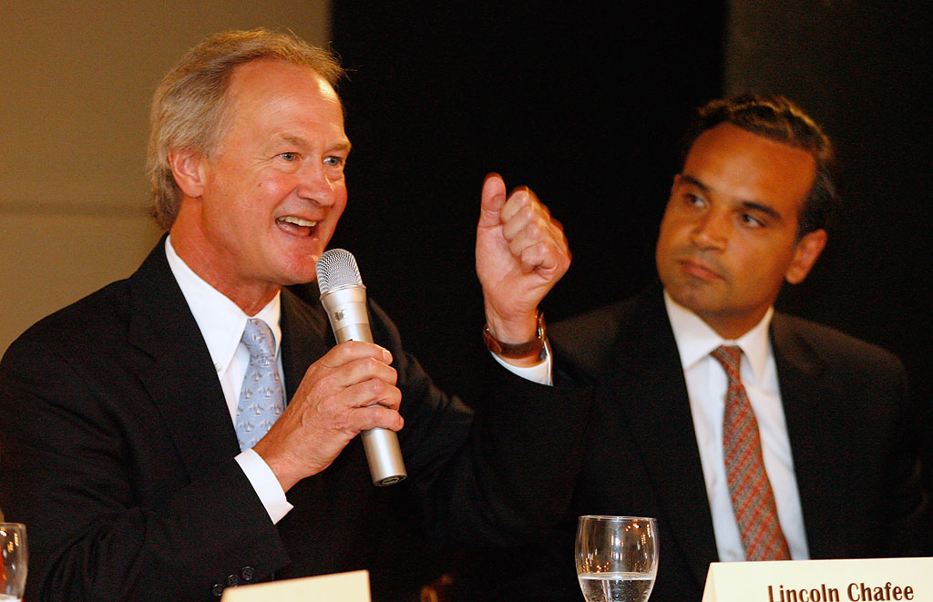 Rhode Island Treasurer and Democratic candidate for governor Frank Caprio, right, listens to independent candidate Lincoln Chafee during a forum at an assisted living center in Providence, R.I., July 21. (Stew Milne/AP)