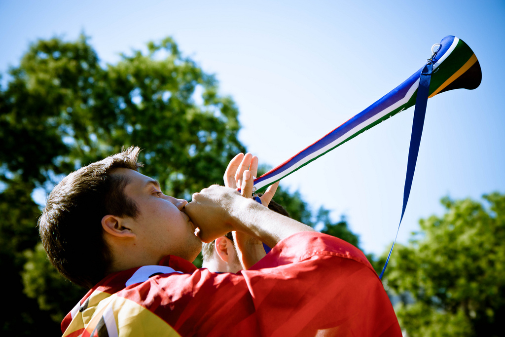 A man blows into a vuvuzela. (Eric P/Flickr)