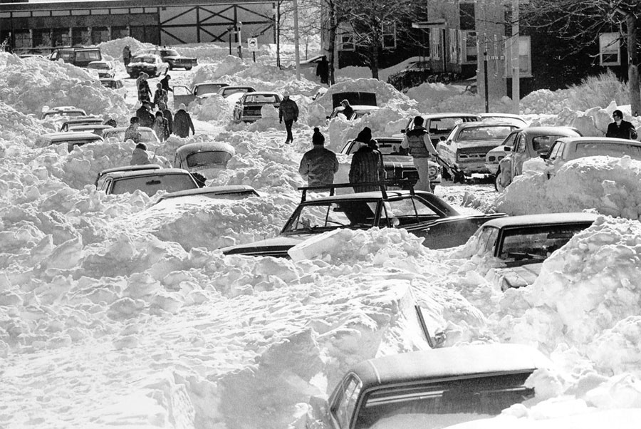 The Blizzard of 1978 dropped an all-time record 27 inches of snow on Boston. Here, residents of Farragut Road in South Boston are digging out their cars from snowdrifts. (AP)