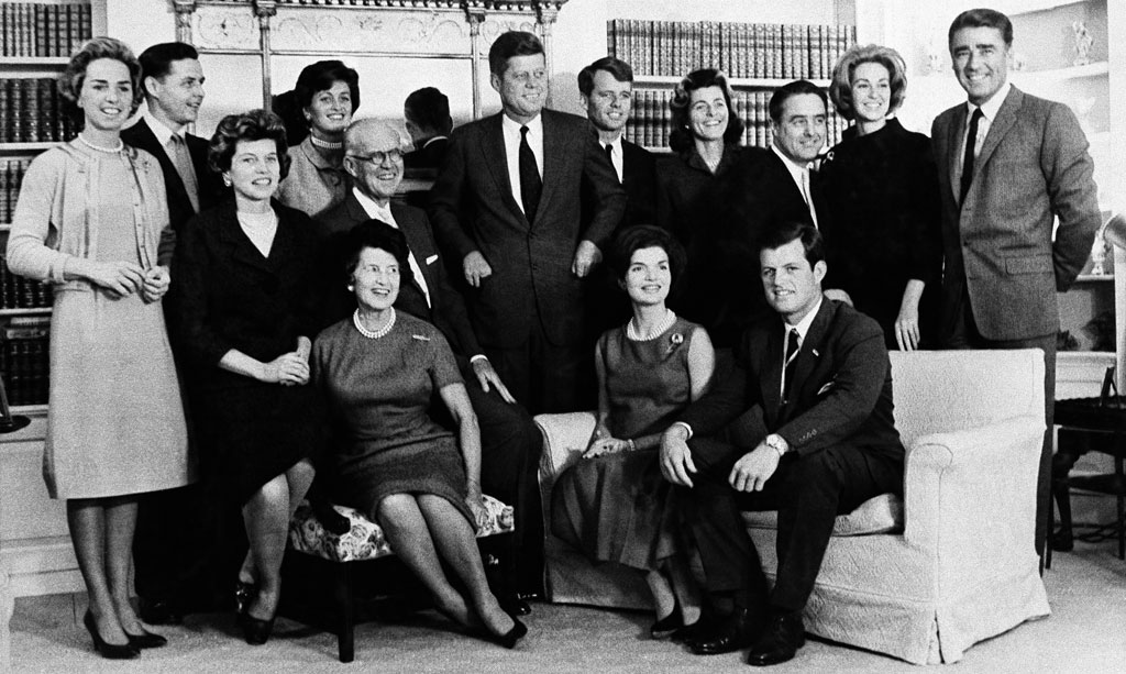 Then President-elect John F. Kennedy is surrounded by members of his family in his parents' home in Hyannisport in December 1960. Standing, left to right Mrs. Robert Kennedy; Steven Smith and wife, Jean Kennedy; Robert Kennedy; sister, Patricia Lawford; Sargent Shriver, brother Ted's wife, Joan; and Peter Lawford. Foreground, left to right: Eunice Shriver, a sister; Joseph Kennedy, his father, with Mrs. Kennedy seated in front; Mrs. John F. Kennedy; and brother Ted Kennedy. (AP)