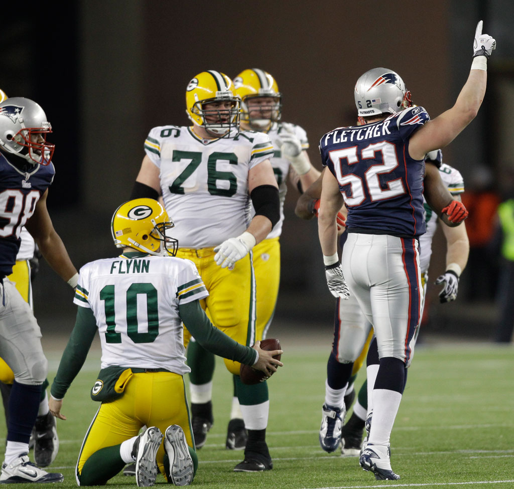 New England Patriots linebacker Dane Fletcher celebrates after sacking Green Bay Packers quarterback Matt Flynn with just under a minute remaining on Dec. 19, 2010, in Foxborough.