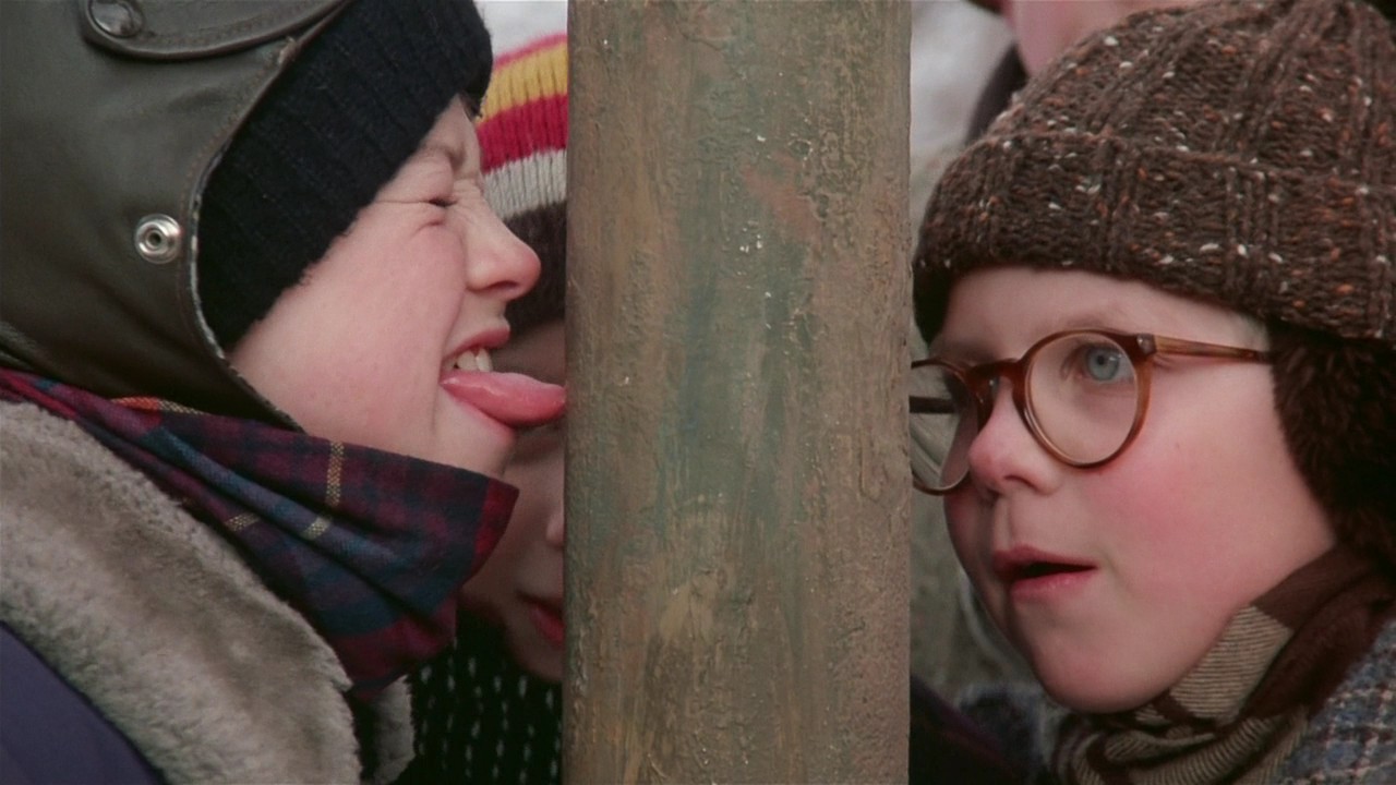 A scene from the film "A Christmas Story," in which a boy's frozen tongue is stuck to a pole.
