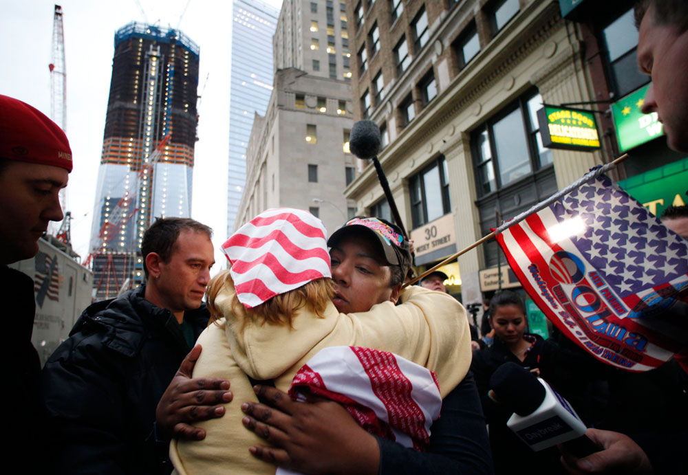 Dionne Layne, facing the camera, hugs Mary Power at ground zero in New York City Monday as they react to Osama bin Laden's death. (AP)
