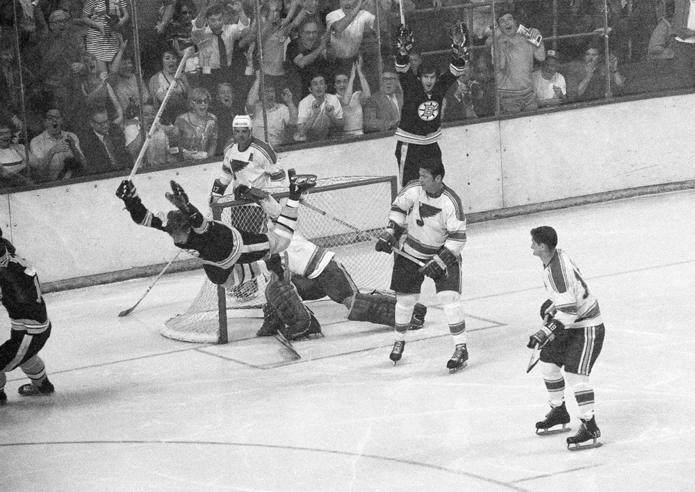 Bobby Orr flies through the air after driving the winning goal by St. Louis Blues' goalie Glenn Hall in sudden death overtime to win the Stanley Cup. (AP)